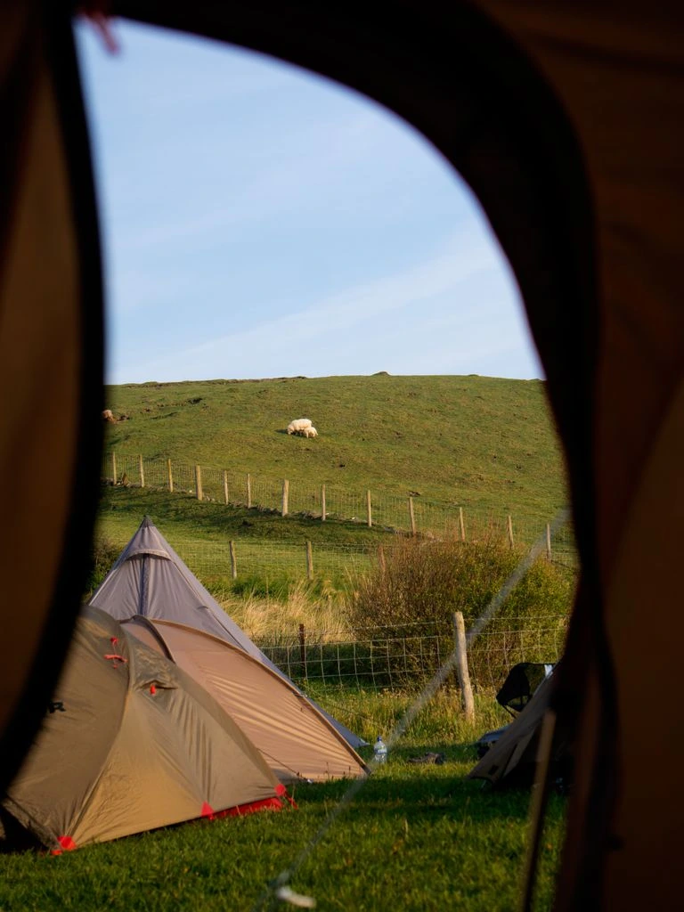 A small festival camping field at the edge of Lyme Regis